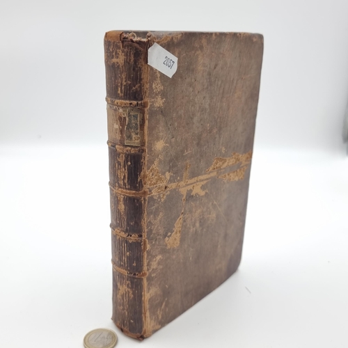 559 - An antique velum bound publication entitled 