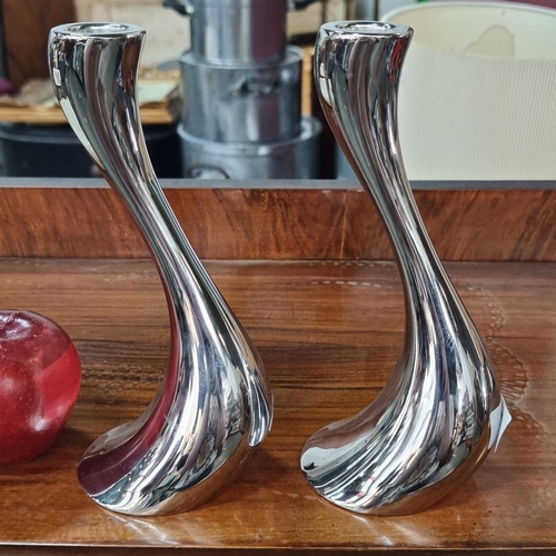 561 - A pair of beautiful candle stick holders by Danish designer Georg Jensen. This pair is named 