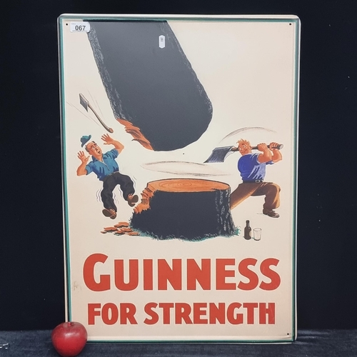 67 - A large metal advertising sign for Guinness reading 