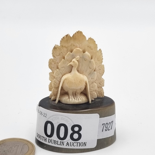 8 - A nice example of an early 19th century Indian figure of a hand carved peacock, mounted on a nice po... 