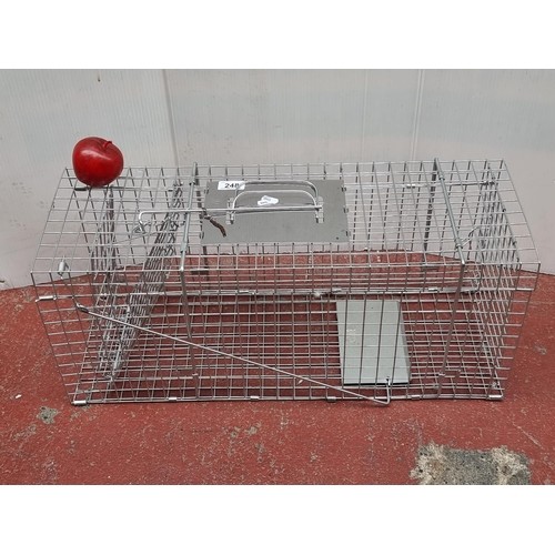 213 - An as new metal wildlife trapping cage. Mm: L67cm x W24cm x H28cm As new.