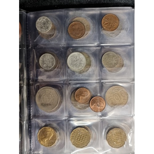 123 - A complete coin album filled with a large quantity of coins from a variety of locations. Including C... 