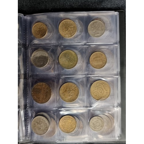 123 - A complete coin album filled with a large quantity of coins from a variety of locations. Including C... 