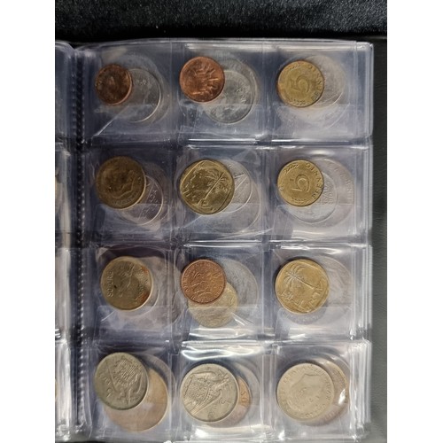 123 - A complete coin album filled with a large quantity of coins from a variety of locations. Including C... 