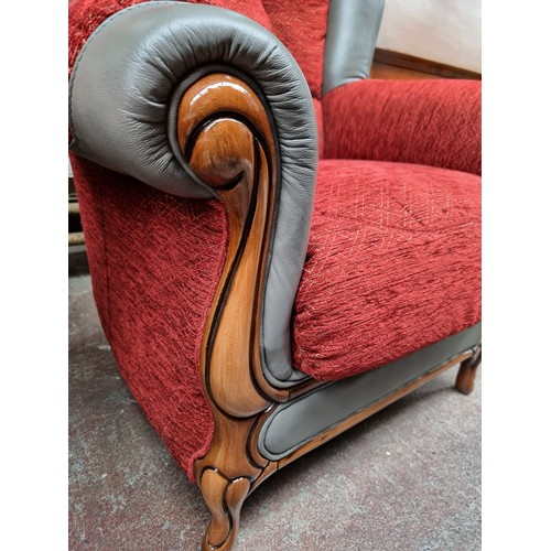 386 - A lovely Italian made fireside chair, with a carved wooden frame and a fantastic grey leather and wo... 