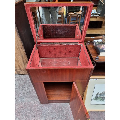 394 - A super retro drinks cabinet with large storage cabinet to base, and mirrored glass storage to top w... 