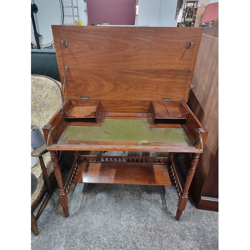 477 - A lovely example of an Edwardian golden mahogany writing bureau on ceramic casters, with finely turn... 