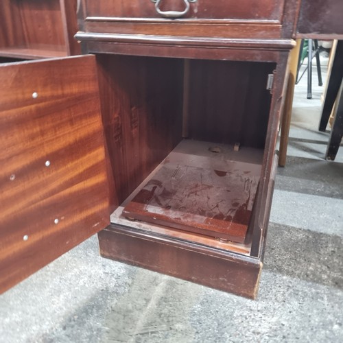 479 - Star Lot : A handsome twin pedestal desk with tooled green leather inlay, ample storage by way of tw... 