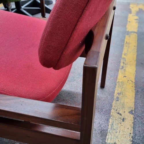 423 - A stunning mid century Danish easy chair with oak wood frame and angled seat upholstered in a red fa... 