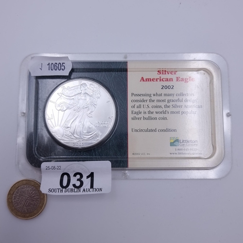 31 - An American uncirculated silver eagle coin from 2002. With a silver content of 99.93% and a weight o... 