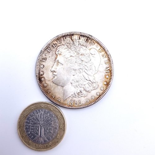 32 - A 1889 Morgan USA 1 Dollar coin, with a silver content of 90%. Weight: 26.75 grams.