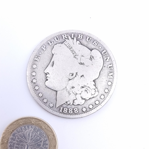 34 - An 1888 O Morgan Dollar F Fine 90% Silver $1 US Coin. Weight: 25.40 grams.
