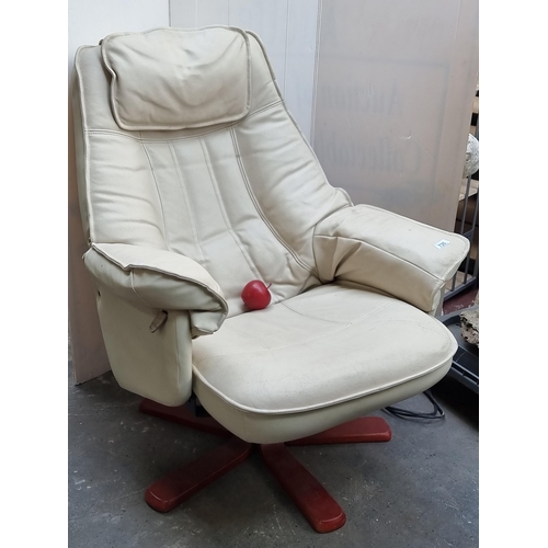 730 - A very comfortable deep seated swivel chair upholstered in a cream leather and on wooden swivel base... 