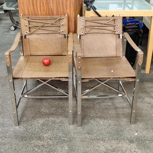 755 - Star Lot : Two very cool and stylish mid century open armed chairs on chrome frames upholstered in a... 