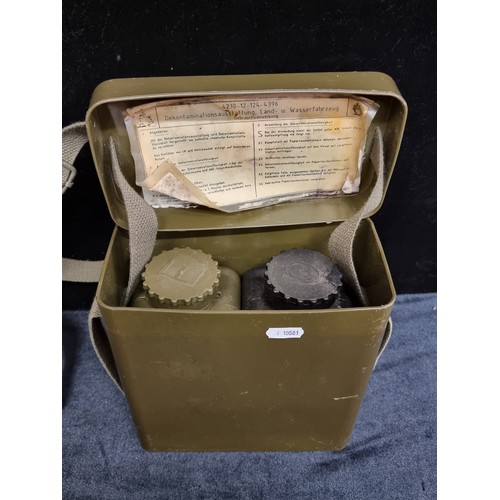 139 - German 1960s military decontamination set for land and water, with re-adjustable strap.