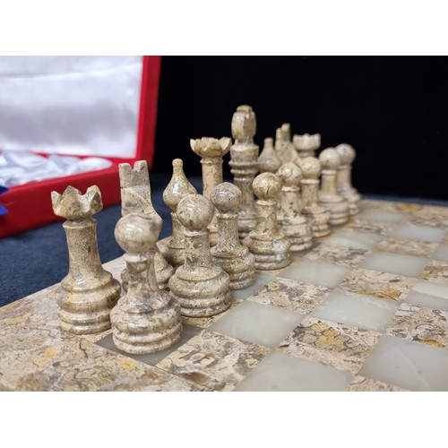 162 - A fantastic vintage marble and alabaster chess board, complete with a full thirty two matching chess... 