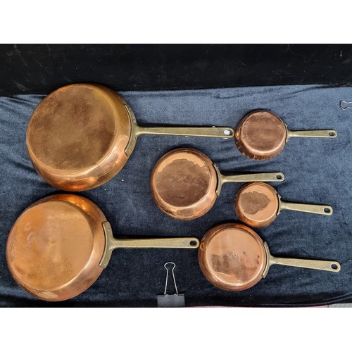 185 - A wonderful collection of 6 vintage copper pans ranging in graduating sizes.