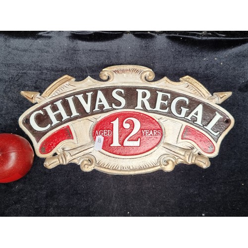 752 - A heavy cast metal wall mounting plaque for Chivas Regal showing the drinks emblem.