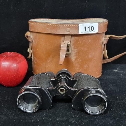 110 - A pair of vintage binoculars with magnification 8x25. Accompanied by leather carry case.