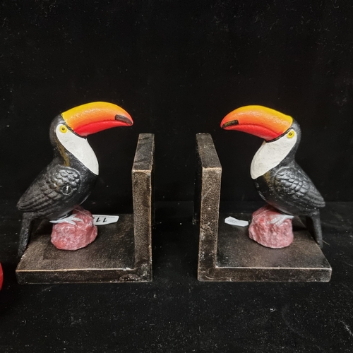 113 - A pair of heavy cast metal bookends featuring the iconic Guinness toucan.