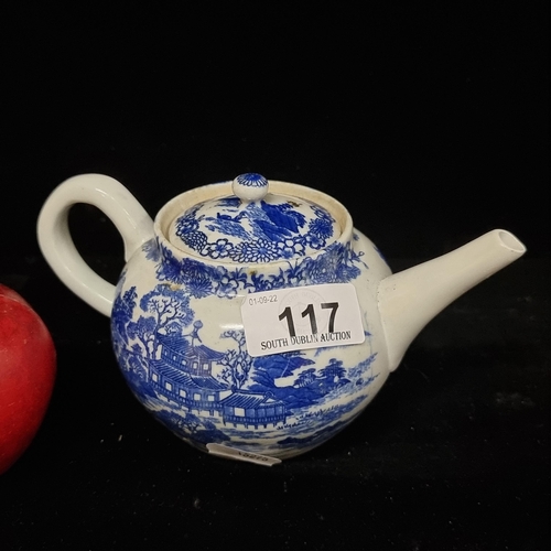 117 - An antique Early possibly 18th century Chinese porcelain teapot with blue pattern of pagodas and mou... 