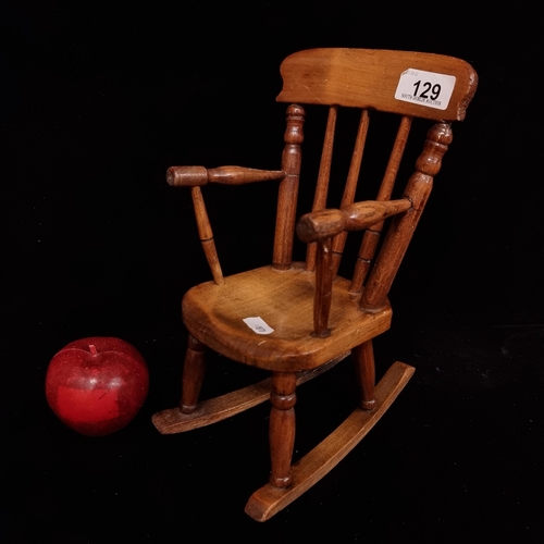 129 - A charming and fully functional, miniature rocking chair. With hand turned spindles and sturdy rails... 