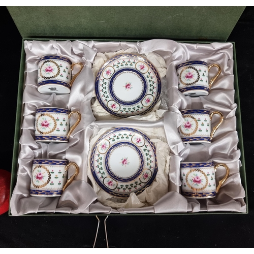 136 - A beautiful complete twelve piece porcelain Coffee set by Crown Porcelain. Featuring a pink rose on ... 