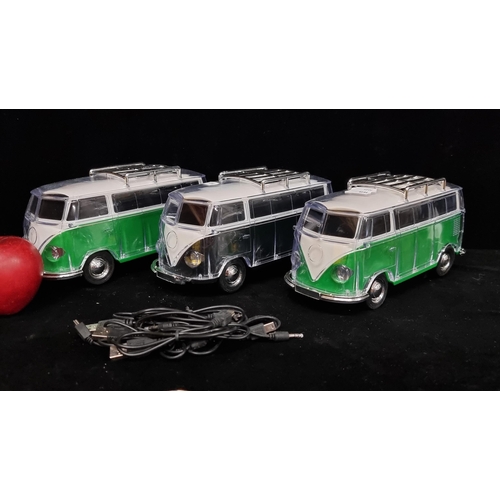 144 - Three model Volkswagen campervan light up radios YPS-288, in shades of green and black.