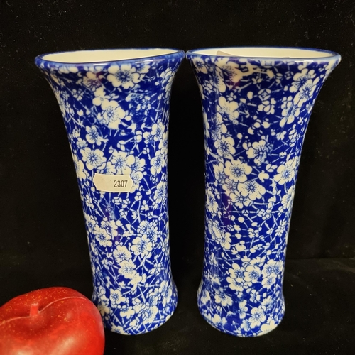 158 - A pair of elegant blue vases by Victorian Ware, with cherry blossom pattern.