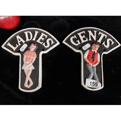 159 - A pair of heavy, cast metal door mounting plaques for ladies and gents toilets.