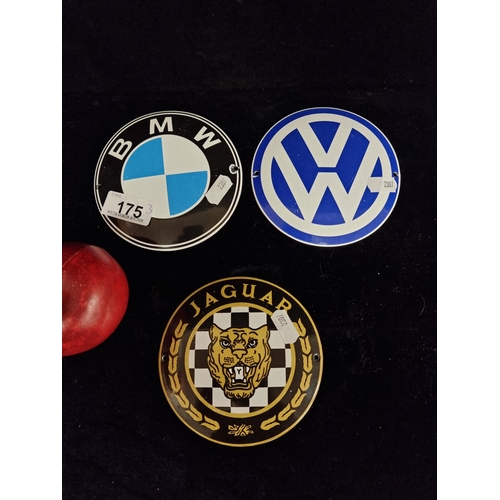 175 - Three metal enamelled car signs in a convex disc shape. Advertising Jaguar, BMW and Volkswagen.