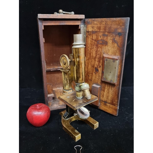 192 - A beautiful example of a 19th century brass microscope, stamped C.Reichert Wenn, housed in a wooden ... 