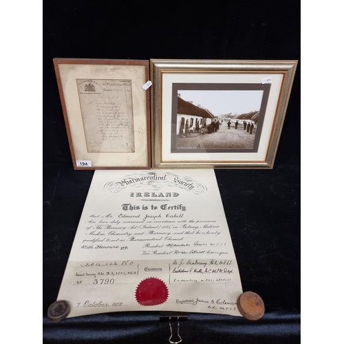 194 - Three antique Irish items comprising of a 1910 receipt from J.J. Graham & Co Chemist, a framed origi... 