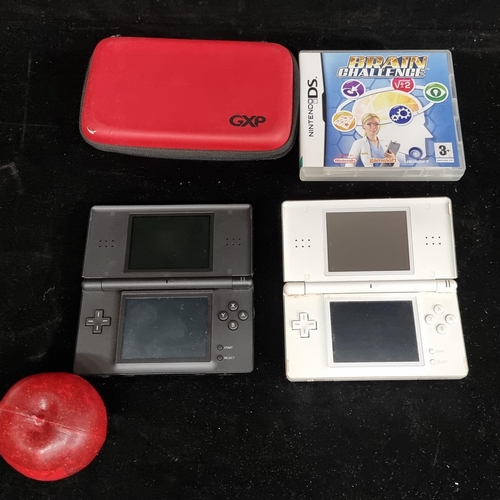 200 - Two Nintendo DS game consoles, along with a carry case and a game entitled Brain Challenge.