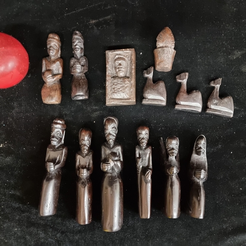 219 - A superb collection of thirteen African hand carved Nativity figures. Crafted from ebonised wood, th... 