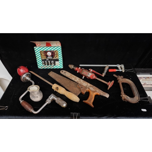 230 - A collection of nine vintage tools and accessories including hand drills, saw, vice and a boxed 