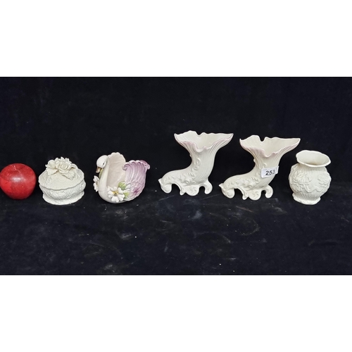 253 - A selection of five porcelain items, including a Belleek épergnes. With a hand moulded ring box.