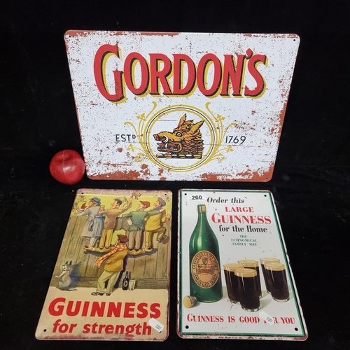 260 - Three metal advertising signs, including two Guinness examples and one for Gordon's gin.