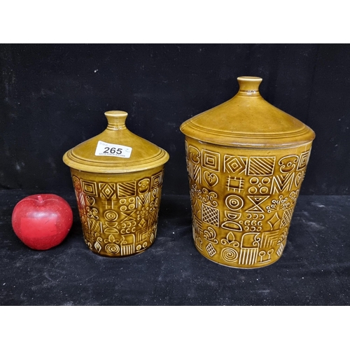 265 - Two striking Arklow pottery ceramic lidded jars with geometric design and a moss green glaze. In goo... 