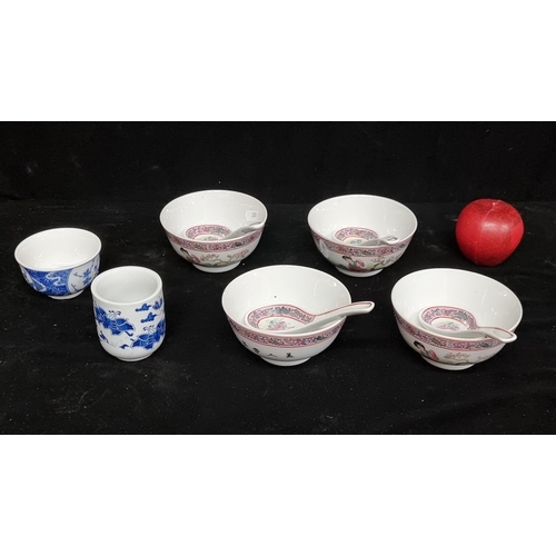 266 - Four Chinese porcelain soup bowls with spoons with hand painted design in shades of pink, along with... 