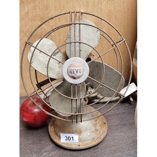 301 - A heavy example of a Revo brand desk fan, circa 1940s.