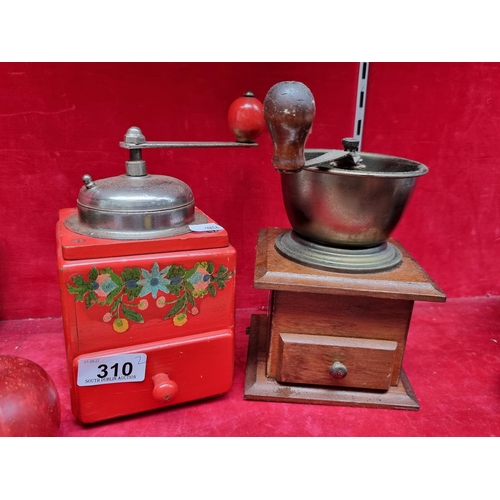 310 - Two mid century coffee grinders, including a red example with floral motif.