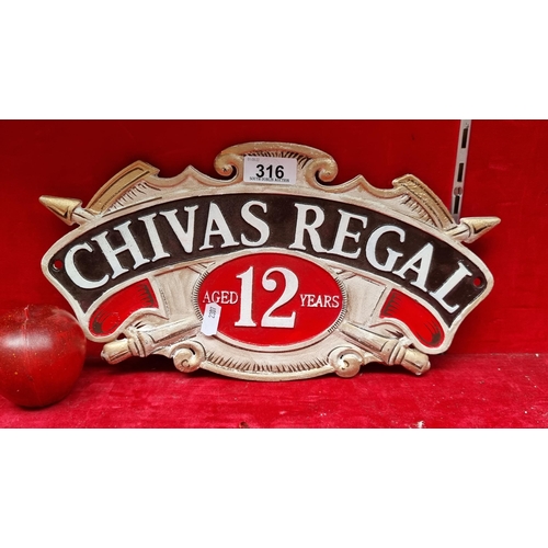 316 - A cast metal wall mounting plaque, advertising 