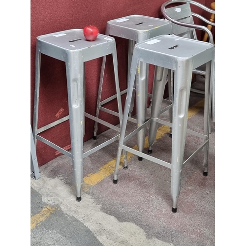 366 - Three metal laboratory stools with silver tone finish and hand holds for picking them up