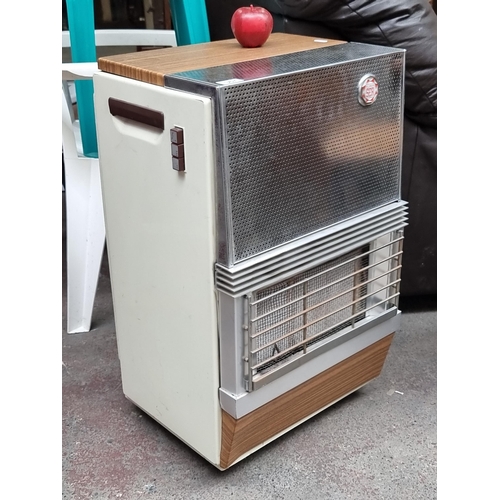 367 - A Super Ser gass heater with wood and cream effect surround. Might need it soon.