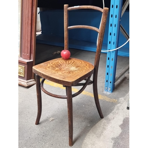 368 - A lovely antique bentwood bistro chair with pretty design to seat.