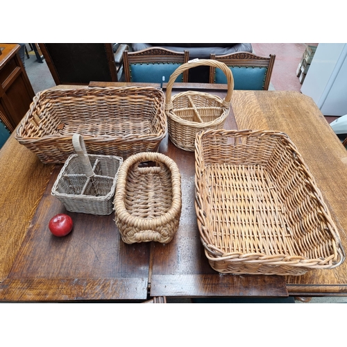 371 - A good collection of 5 woven baskets including two large examples and two handled bottle holder bask... 