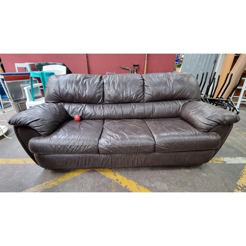 375 - A large chocolate leather brown three seater sofa in good condition.