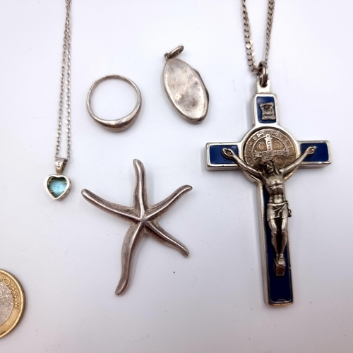 767 - A collection of Sterling Silver items Including a Starfish, locket and a blue topaz pendant, Also a ... 