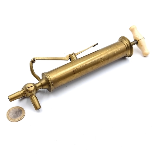 777 - A great antique item with a dublin connection. A brass stomach pump circa 1880s reading 